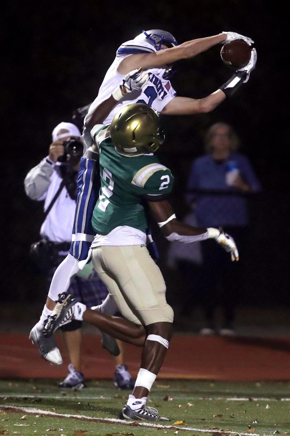 Olentangy Liberty's Alex Okuley makes a leaping, 14-yard touchdown catch over Dublin Jerome's Michael Arinze Ezirim during a Division I regional quarterfinal Nov. 4.