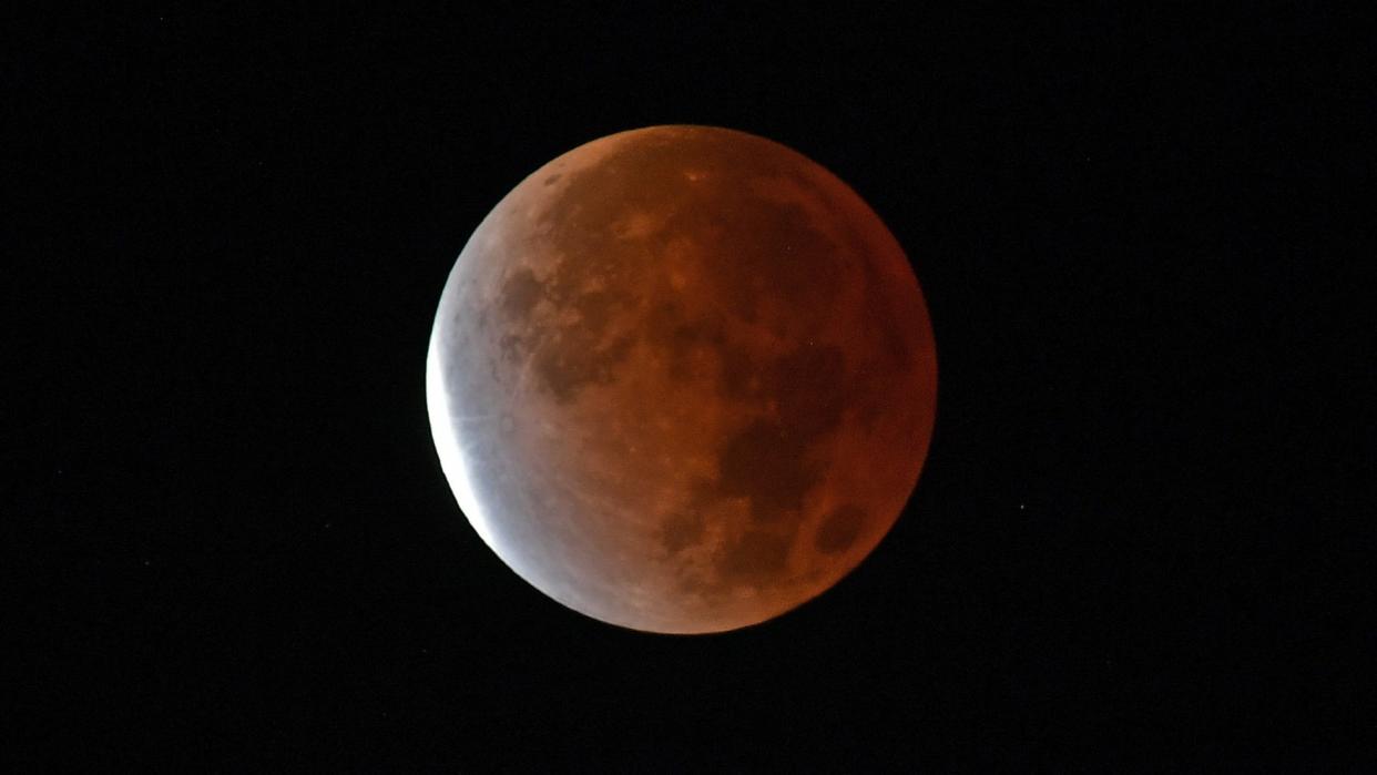  The moon is darkened by Earth's shadow. 