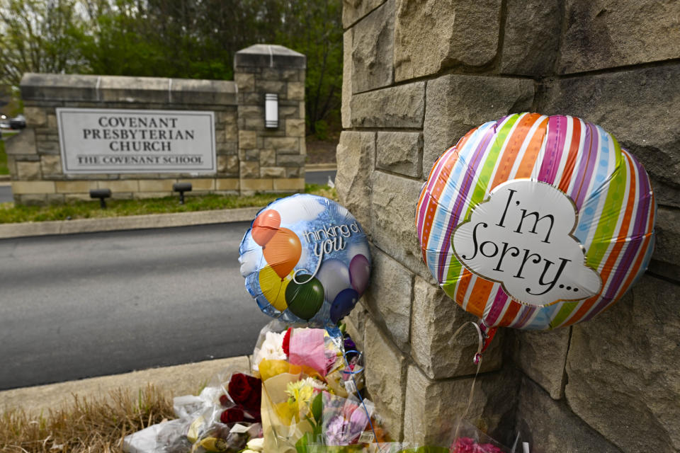 An entry to Covenant School also becomes a memorial for shooting victims, Tuesday, March 28, 2023, in Nashville, Tenn. (AP Photo/John Amis)