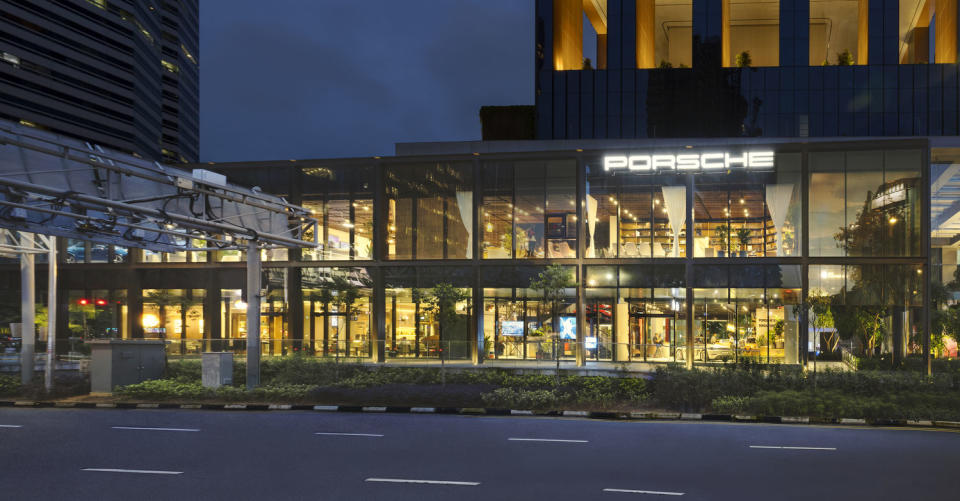 porsche studio singapore guoco midtown night view from main road