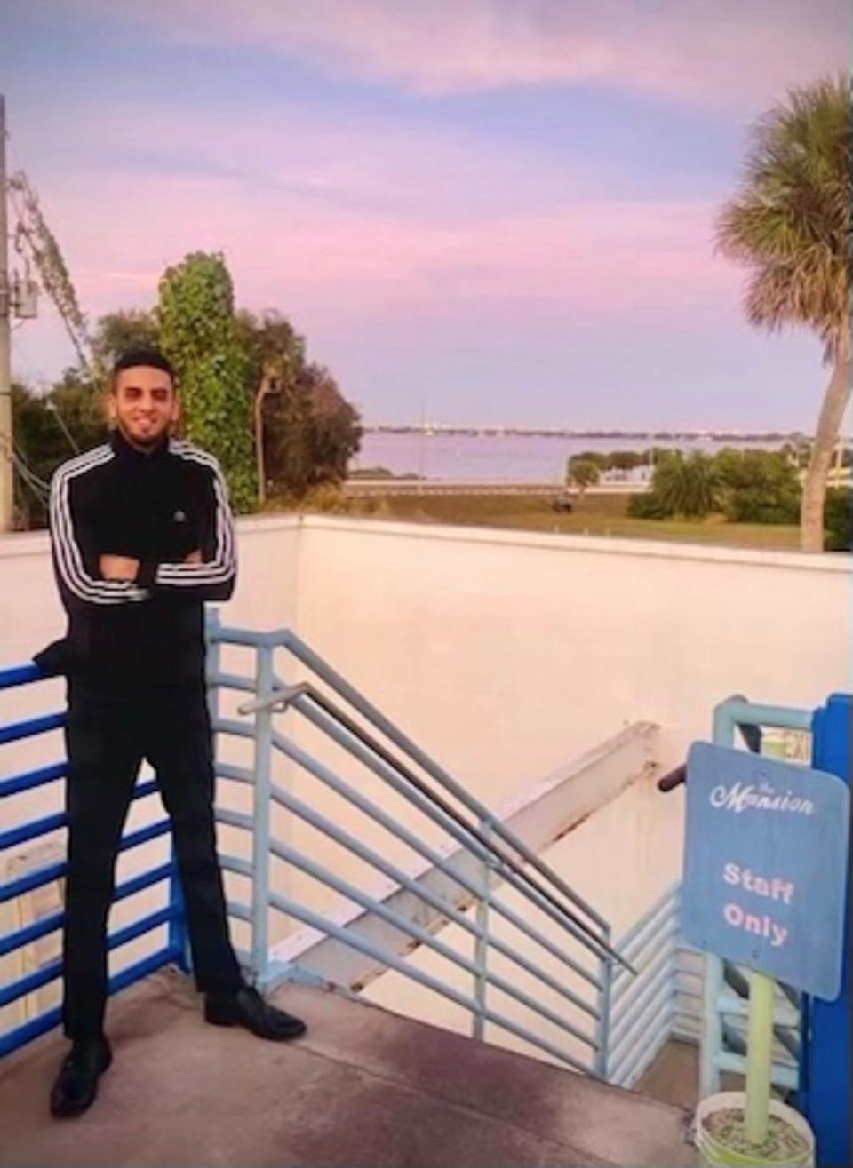 Nate Real stands on the outdoor terrace at sunset at The Mansion, where he worked as a manager.