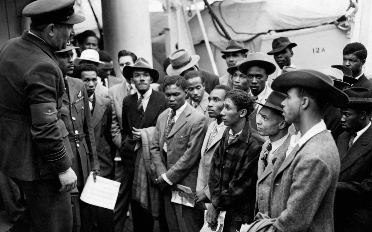 Jamaican immigrants welcomed by RAF officials from the Colonial Office after the ex-troopship HMT 'Empire Windrush' landed them at Tilbury in 1948 - PA