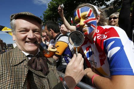 A man dressed in Sherlock Holmes attends the start of the first 190.5 km stage of the Tour de France cycling race from Leeds to Harrogate, July 5, 2014. REUTERS/Jean-Paul Pelissier