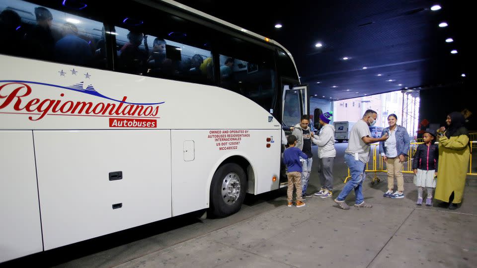 Migrants arrive on a bus from Texas to the Port Authority bus station on October 7, 2022 in New York City. - Leonardo Munoz/VIEWpress/Getty Images