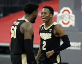 Purdue guard Eric Hunter, right, and teammate forward Trevion Williams celebrate an NCAA college basketball game win over Ohio State in Columbus, Ohio, Tuesday, Jan. 19, 2021. (AP Photo/Paul Vernon)