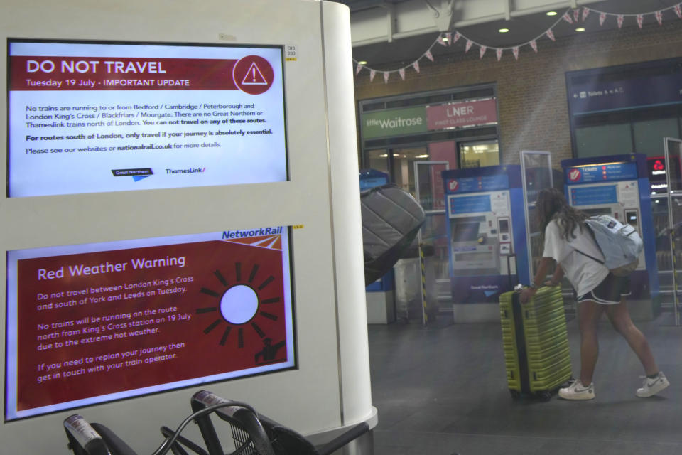 A sign at London’s King’s Cross railway station on Tuesday warns of train cancellations due to the heat.