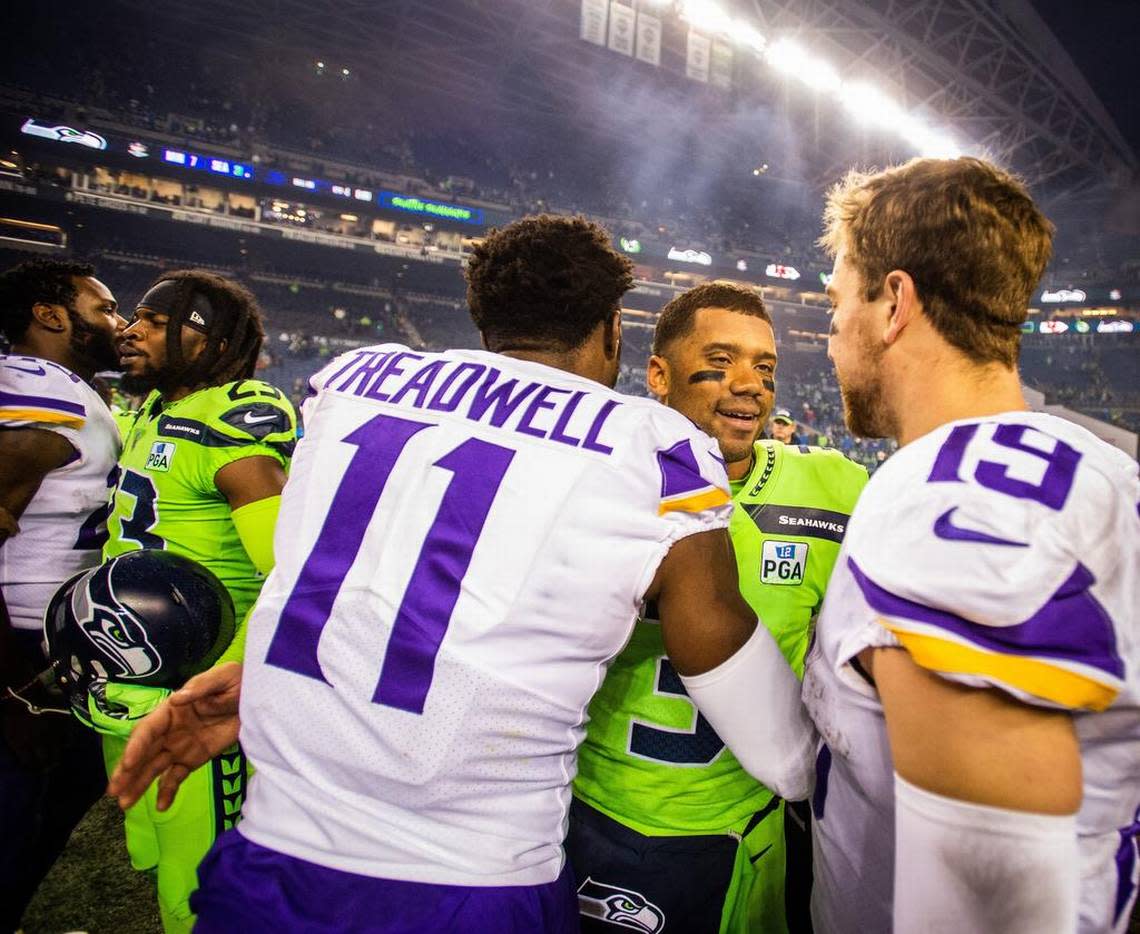 Seahawks quarterback Russell Wilson greets Vikings wide receiver Laquon Treadwell and Vikings wide receiver Adam Thielen after the game. The Seattle Seahawks played the Minnesota Vikings in a NFL football game at CenturyLink Field in Seattle, Wash., on Monday, Dec. 10, 2018.