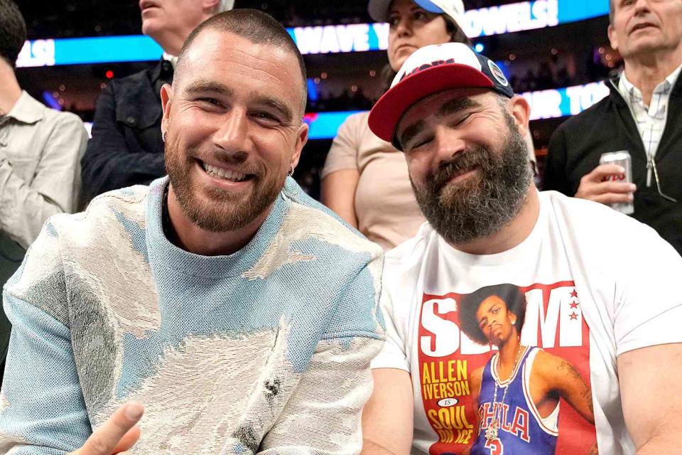 <p>Jesse D. Garrabrant/NBAE via Getty</p> Travis Kelce and Jason Kelce attend a Philadelphia 76ers game