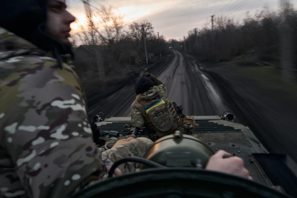 Soldiers on the Armored Infantry Vehicle 2 (BMP-2) on the road to the city, the outskirts of Avdiivka on Feb. 14, 2024. (Vlada Liberova/Libkos/Getty Images)