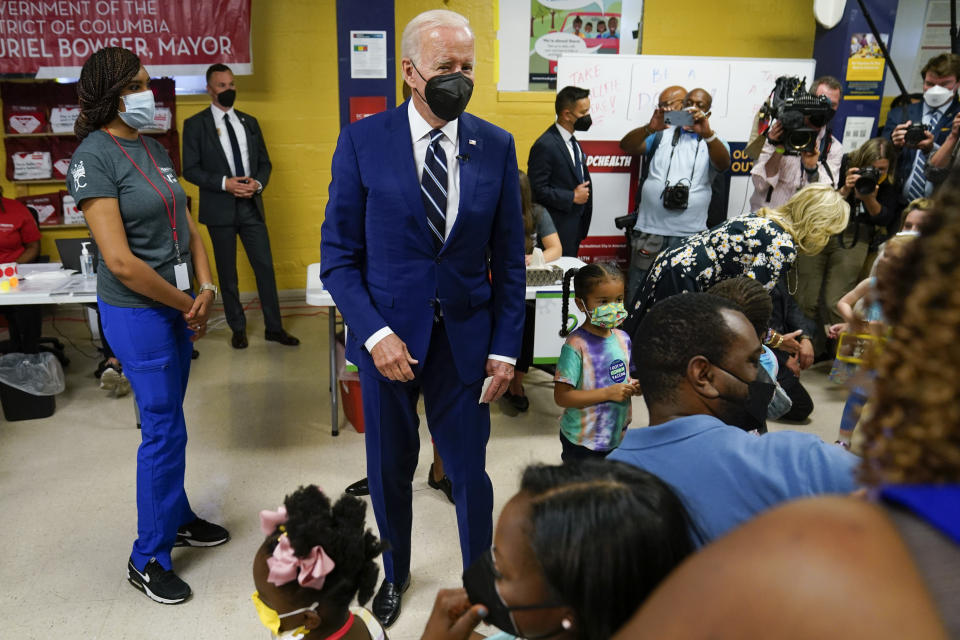 President Joe Biden visits a COVID-19 vaccination clinic at the Church of the Holy Communion Tuesday, June 21, 2022, in Washington. (AP Photo/Evan Vucci)