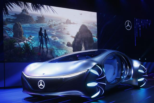 Daimler announces the world premiere of the Mercedes-Benz Vision AVTR concept car at the Daimler Keynote along with a sneak peek of the new Avatar 2 movie, background image, before the CES tech show Monday, Jan. 6, 2020, in Las Vegas. (AP Photo/Ross D. Franklin)