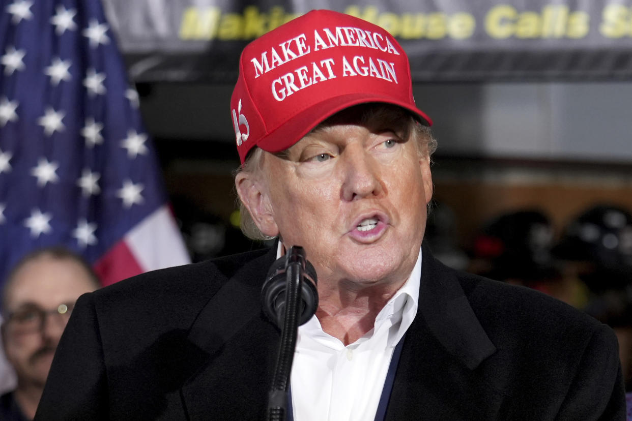 FILE - Former President Donald Trump speaks at the East Palestine Fire Department as he visits the area in the aftermath of the Norfolk Southern train derailment Feb. 3 in East Palestine, Ohio, Feb. 22, 2023. Trump’s lawyers in Georgia are criticizing the Fulton County investigation into potential illegal election meddling after the foreperson of the special grand jury seated to help the probe went public this week. (AP Photo/Matt Freed, File)