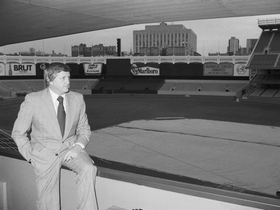 Yankee owner George Steinbrenner looks out to an empty Yankee Stadium in 1977.