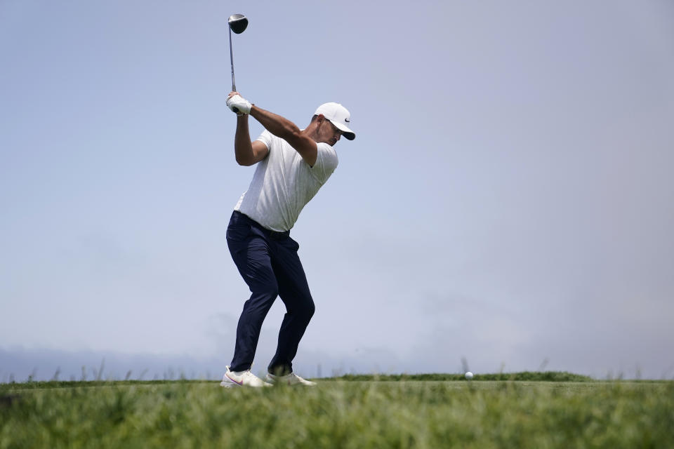 Brooks Koepka hits from the fourth tee during the first round of the U.S. Open Golf Championship, Thursday, June 17, 2021, at Torrey Pines Golf Course in San Diego. (AP Photo/Jae C. Hong)