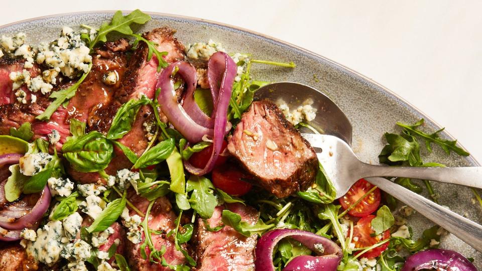 grilled steak salad with avocado, blue cheese, cherry tomatoes and red onions