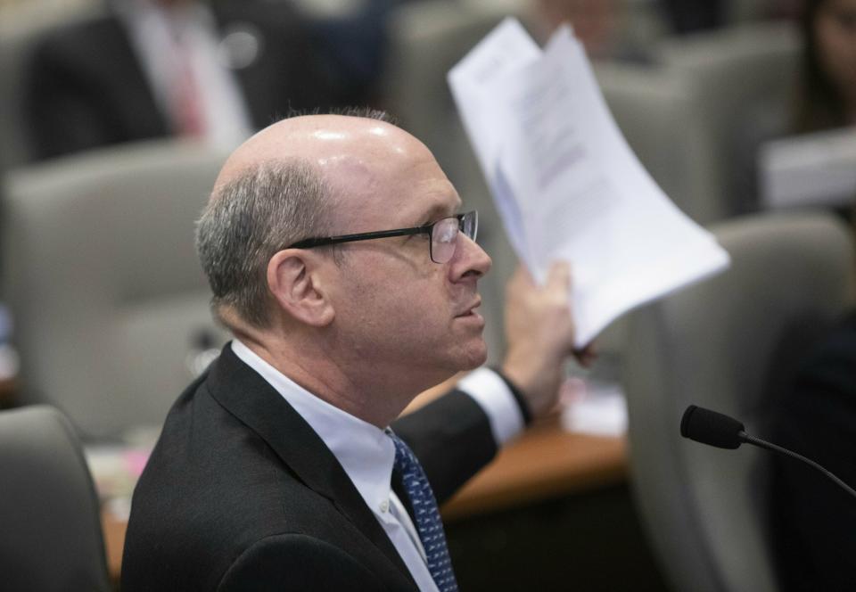 Marc Elias, an attorney for Democratic congressional candidate Dan McCready, expresses frustration after new documents were entered into evidence during the fourth day of a public evidentiary hearing on the 9th Congressional District voting irregularities investigation Thursday, Feb. 21, 2019, at the North Carolina State Bar in Raleigh. (Travis Long/The News & Observer via AP)