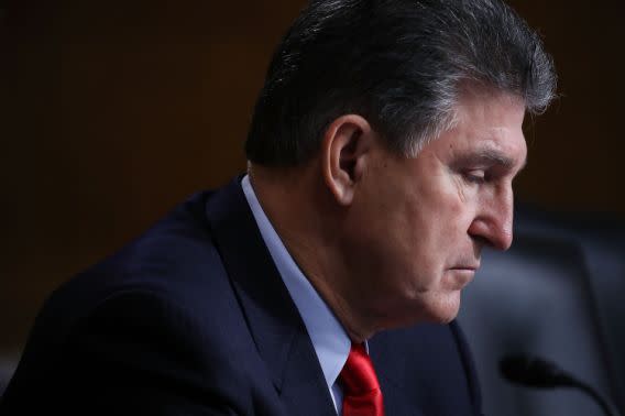 Sen. Joe Manchin looks at his papers during a Senate Health, Education, Labor and Pensions Committee hearing on Capitol Hill last January. (Photo: Mark Wilson/Getty Images)