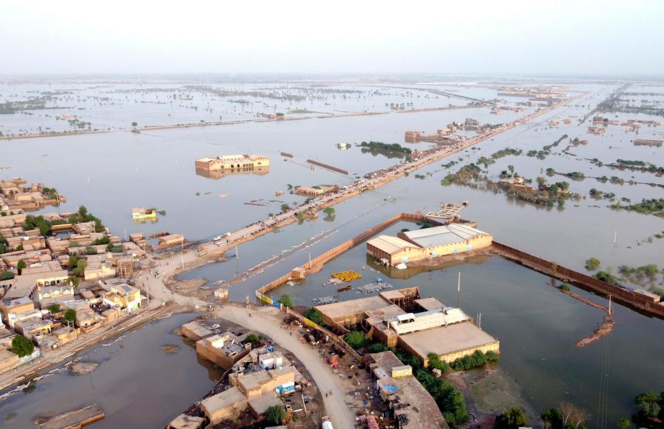 Homes are surrounded by floodwaters in Sohbat Pur city of Jaffarabad, a district of Pakistan's southwestern Baluchistan province, on August 29, 2022.