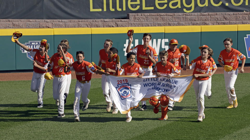 River Ridge, Louisiana takes a victory lap around the field at Lamade Stadium after winning the Little League World Series Championship game against Curacao, 8-0, in South Williamsport, Pa., Sunday, Aug. 25, 2019. (AP Photo/Gene J. Puskar)