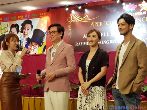 Producer Raymond Wong with "All's Well, Ends Well 2020" cast members Dada Chan and Adam Pak greeting the crowd.