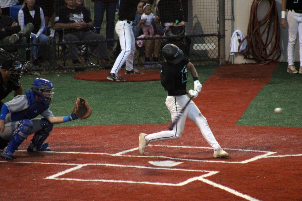 Providence leadoff hitter Waz Rollings swings and hits a sacrifice fly against Fernandina Beach on May 4.