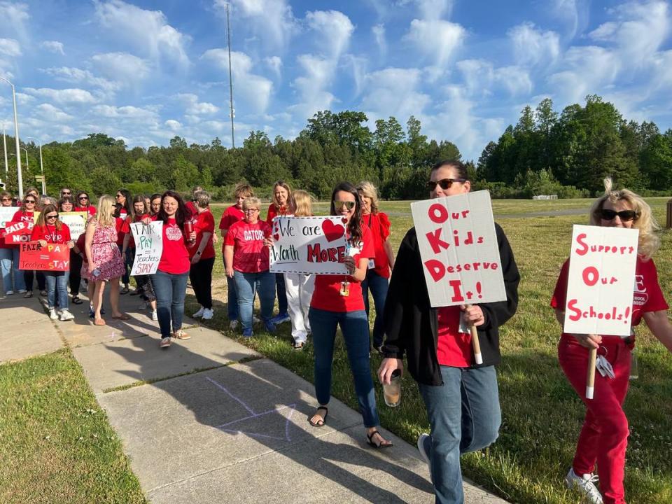 Teachers hold a “walk-in” at Abbotts Creek Elementary School in Raleigh, N.C., on April 30, 2024 to lobby the Wake County school board to include bigger raises in the school budget.