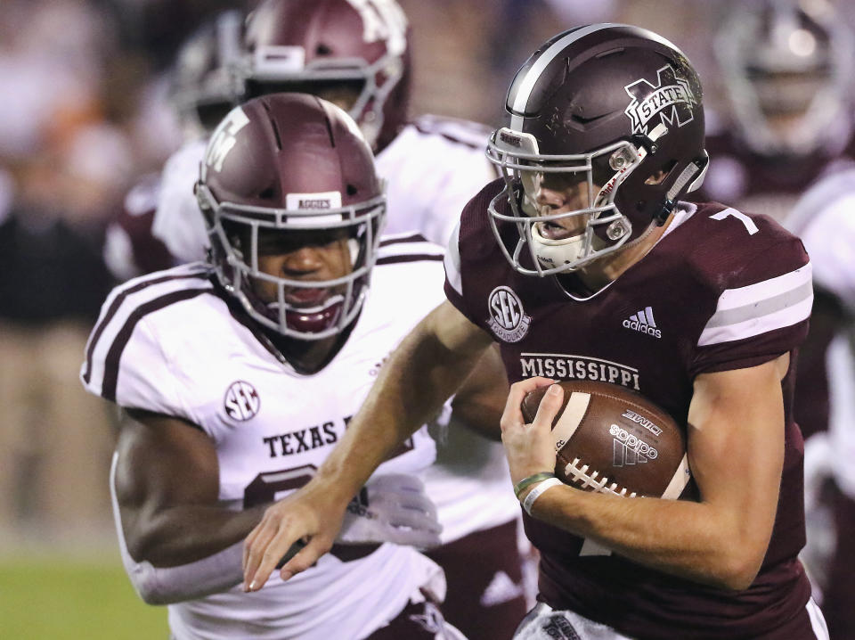 Mississippi State quarterback Nick Fitzgerald (7) rushes for additional yards as Texas A&M linebacker Tyrel Dodson (25) pursues during the first half of an NCAA college football game Saturday, Oct. 27, 2018, in Starkville, Miss. (AP Photo/Jim Lytle)