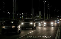 Cars drive in front of 2016 Rio Olympic Park in Rio de Janeiro, Brazil, July 31, 2016. REUTERS/Ricardo Moraes