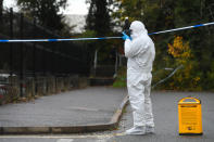 A forensic officer at the scene on Russell Way in Crawley, West Sussex, after a 24-year-old man was fatally stabbed on Tuesday night.