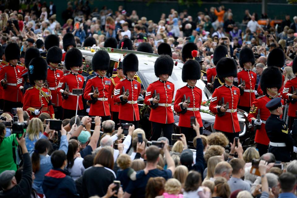 Watched by thousands and flanked by troops, the state Royal Hearse carrying the coffin of Queen Elizabeth II drives down the Long Walk to Windsor Castle for a committal service at St George's Chapel, Sept. 19, 2022.