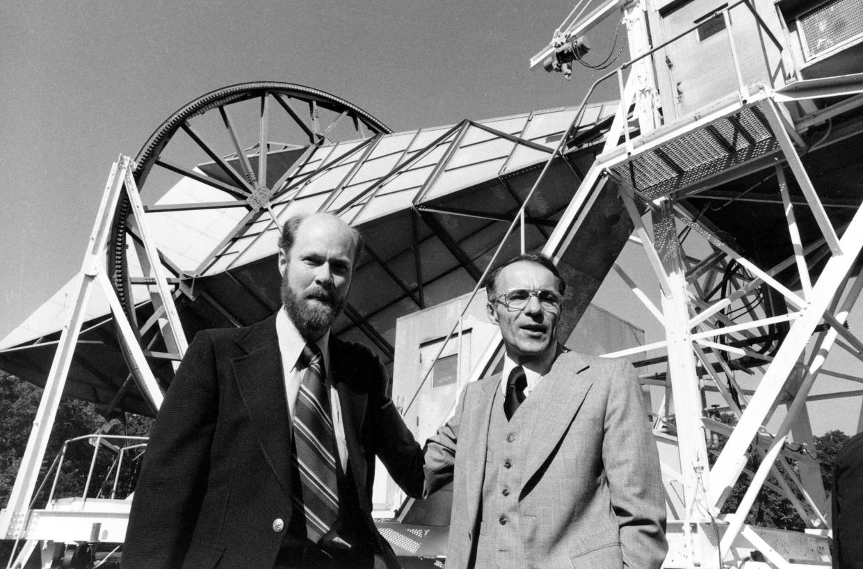 Robert W. Wilson, left, and Arno Penzias, Bell Lab employees who won the 1978 Nobel Prize in physics, are shown standing in front of their microwave Horn Antenna at Bell Labs in Holmdel, N.J., Oct. 17, 1978.  (AP Photo)