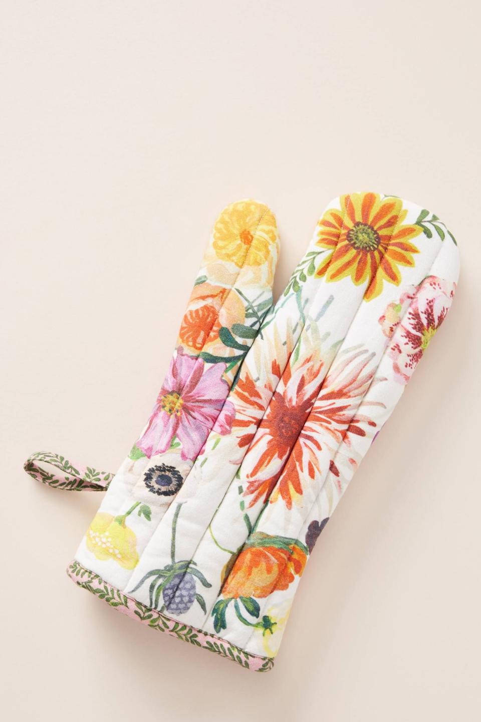<p><strong>Nathalie Lete</strong></p><p>anthropologie.com</p><p><strong>$16.00</strong></p><p>Liven up their kitchen while keeping their hands safe with this fun oven mitt. Just try not to go overboard and buy one for every single friend. 😂</p>