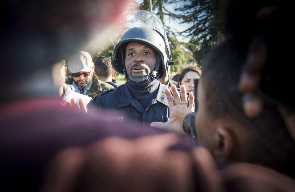 <p>CHP officer Matthew Burgess, pleads with Black Lives Matter supporters to move off Interstate 5 after a they converged on the interstate and closed it down during rush hour traffic in Sacramento in protest of the death of unarmed Stephon Clark in South Sacramento on Thursday, March 22, 2018. (Photo: Hector Amezcua/TNS via ZUMA Wire) </p>