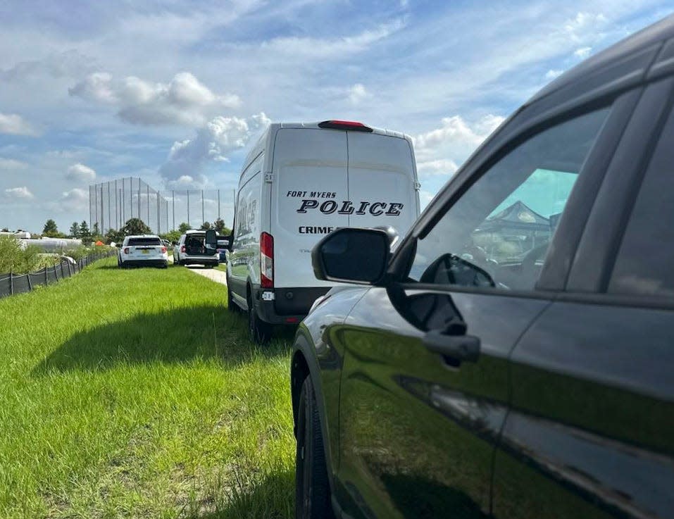 Fort Myers Police work the scene at a retention pond near Topgolf where a vehicle was recovered on Monday, June 26, 2023.