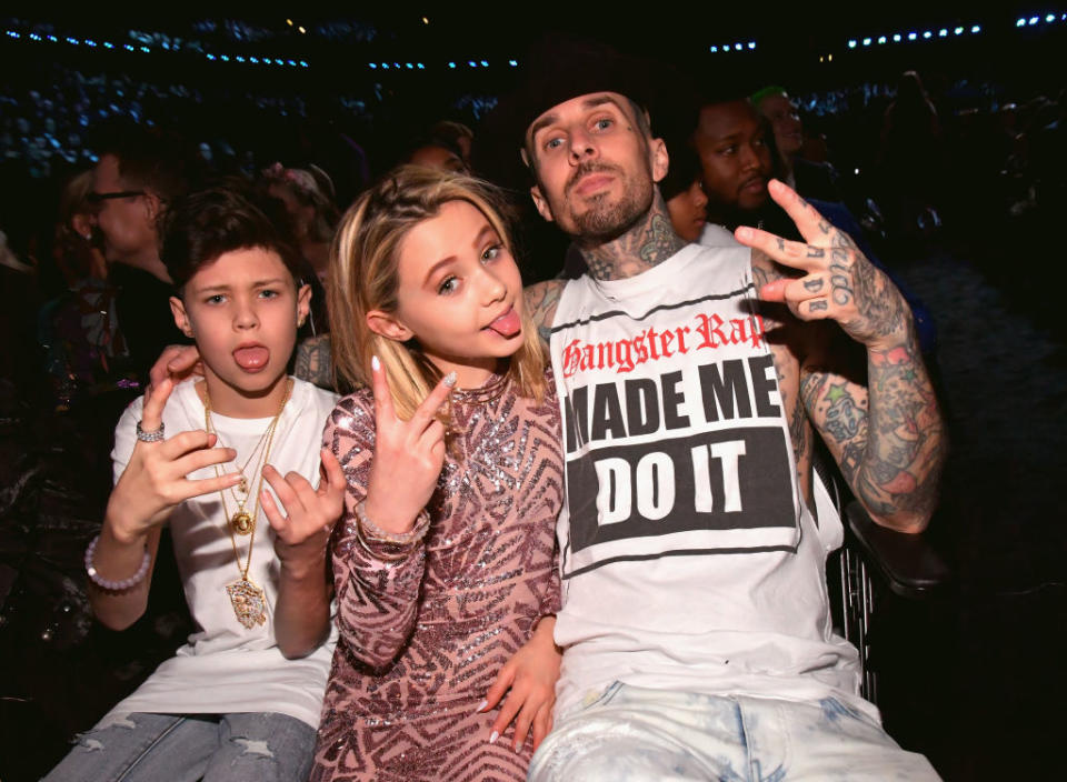 Travis Barker sits with his kids, Landon and Alabama, at Grammy Awards on Feb. 12, 2017. (Photo: Lester Cohen/Getty Images for NARAS)