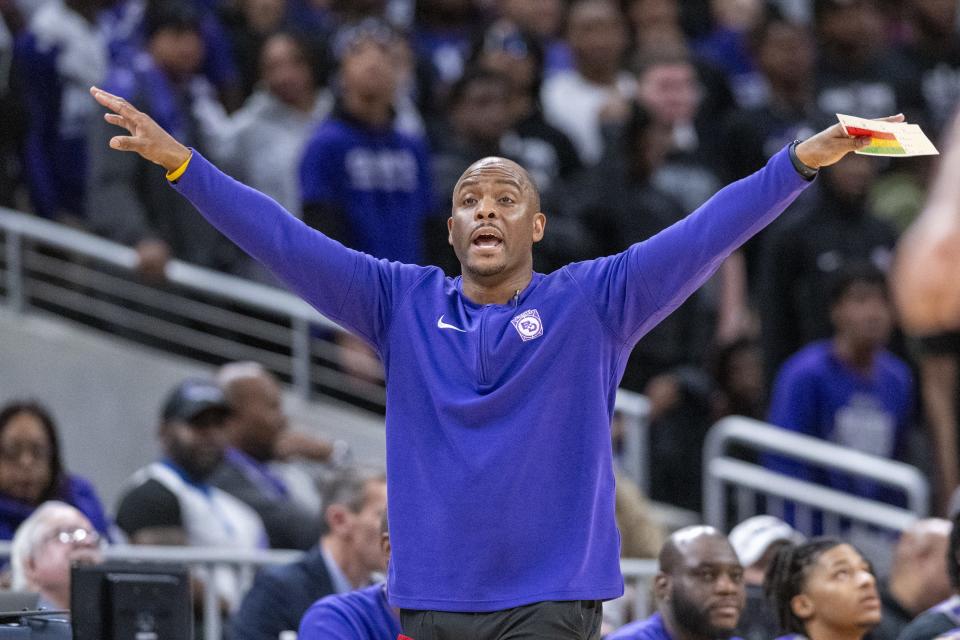 Ben Davis High School head coach Corey Taylor reacts to play on the court during the first half of an IHSAA class 4A state championship basketball game against Fishers High School, Saturday, March 30, 2024, at Gainbridge Fieldhouse.