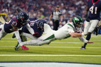 New York Jets quarterback Zach Wilson (2) carries for a touchdown against Houston Texans free safety Eric Murray (23) in the second half of an NFL football game in Houston, Sunday, Nov. 28, 2021. (AP Photo/Eric Smith)