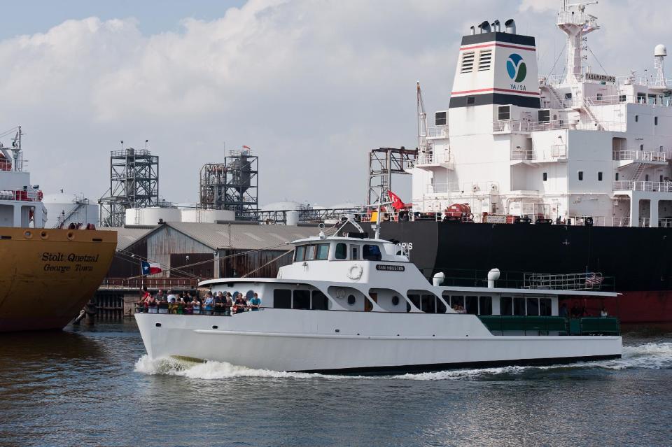 This June 2011 photo released by the Greater Houston Convention and Visitors Bureau, shows sightseers aboard the Sam Houston, a boat that offers a 90-minute cruise of the Houston Ship Channel. Reservations are required but the cruise is free, one of a number of free attractions in Houston. (AP Photo/Greater Houston Convention and Visitors Bureau)