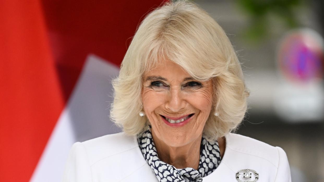  Queen Camilla visits the central Paris Flower Market. 