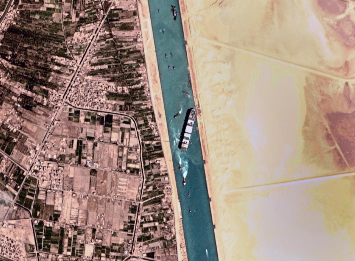 This satellite photo from Planet Labs Inc. shows the Ever Given cargo ship stuck in Egypt's Suez Canal on Monday, March 29, 2021. Engineers on Monday "partially refloated" the colossal container ship that continues to block traffic through the Suez Canal, authorities said, without providing further details about when the vessel would be set free.