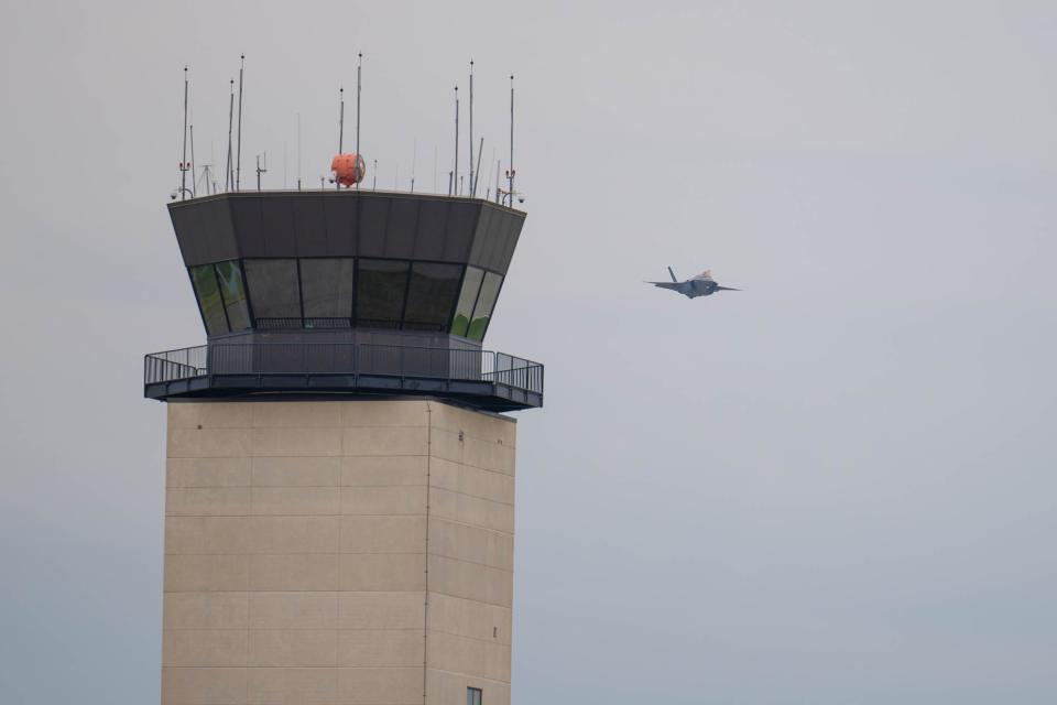 A F18 fighter jet makes a pass by the tower at the Field of Flight Air Show and Balloon Festival on Friday, July 1, 2022.