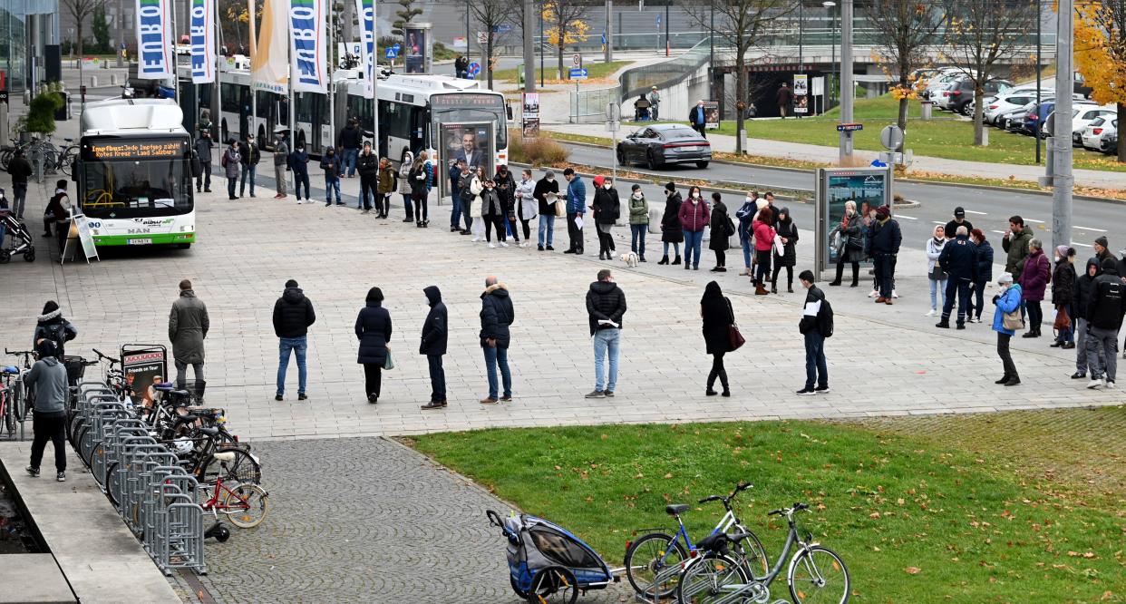 People stand in line to get a vaccination against Covid-19 at the 