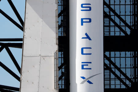 A SpaceX Falcon 9 carrying the Crew Dragon spacecraft sits on launch pad 39A prior to the uncrewed test flight to the International Space Station from the Kennedy Space Center in Cape Canaveral, Florida, U.S., March 1, 2019. REUTERS/Mike Blake