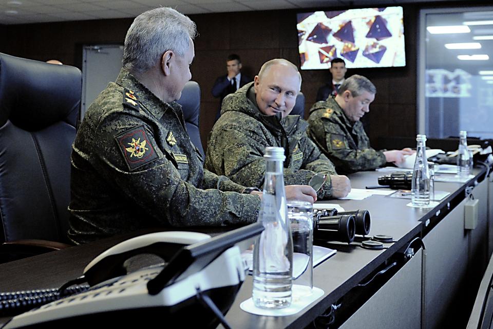 Russian President Vladimir Putin, center, flanked by General Staff chief, Gen. Valery Gerasimov, right, and Defense Minister Sergei Shogu, left, attend the Vostok 2022 (East 2022) military exercise in fareastern Russia, outside Vladivostok, on Tuesday, Sept. 6, 2022. The weeklong exercise that began Thursday is intended to showcase growing defense ties between Russia and China and also demonstrate that Moscow has enough troops and equipment to conduct the massive drills even as its troops are engaged in military action in Ukraine. (Mikhail Klimentyev, Sputnik, Kremlin Pool Photo via AP)