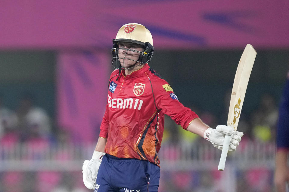 Punjab Kings' Sam Curran celebrates scoring fifty runs during the Indian Premier League cricket match between Rajasthan Royals and Punjab Kings in Guwahati, India, Wednesday, May. 15, 2023. (AP Photo/Anupam Nath)