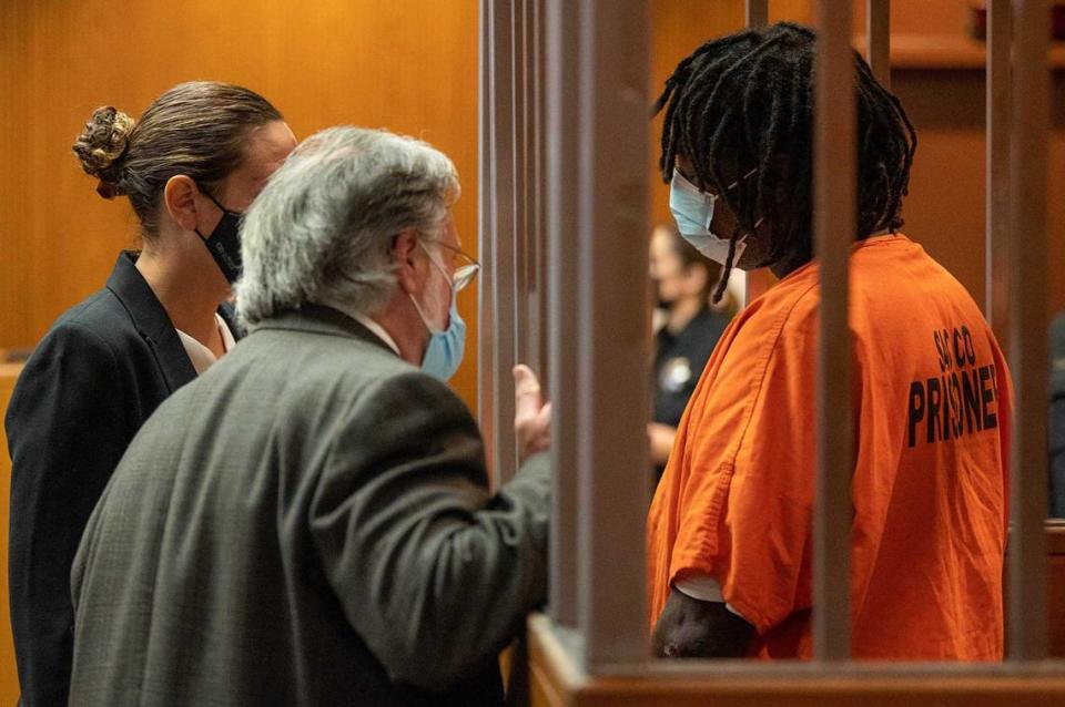 Troy Davis consults with lawyers during his arraignment in Sacramento Superior Court on Sept. 7, 2021. A police detective, testifying during a preliminary hearing for Davis on Wednesday, said that Davis admitted he attacked and killed Kate Tibbitts and her two dogs in her Land Park home two years ago.