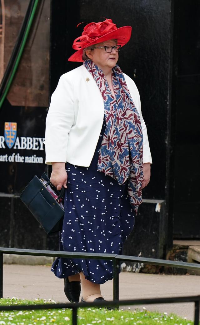 Th&#xe9;r&#xe8;se Coffey wore a union jack scarf paired with a printed day dress (Getty Images)