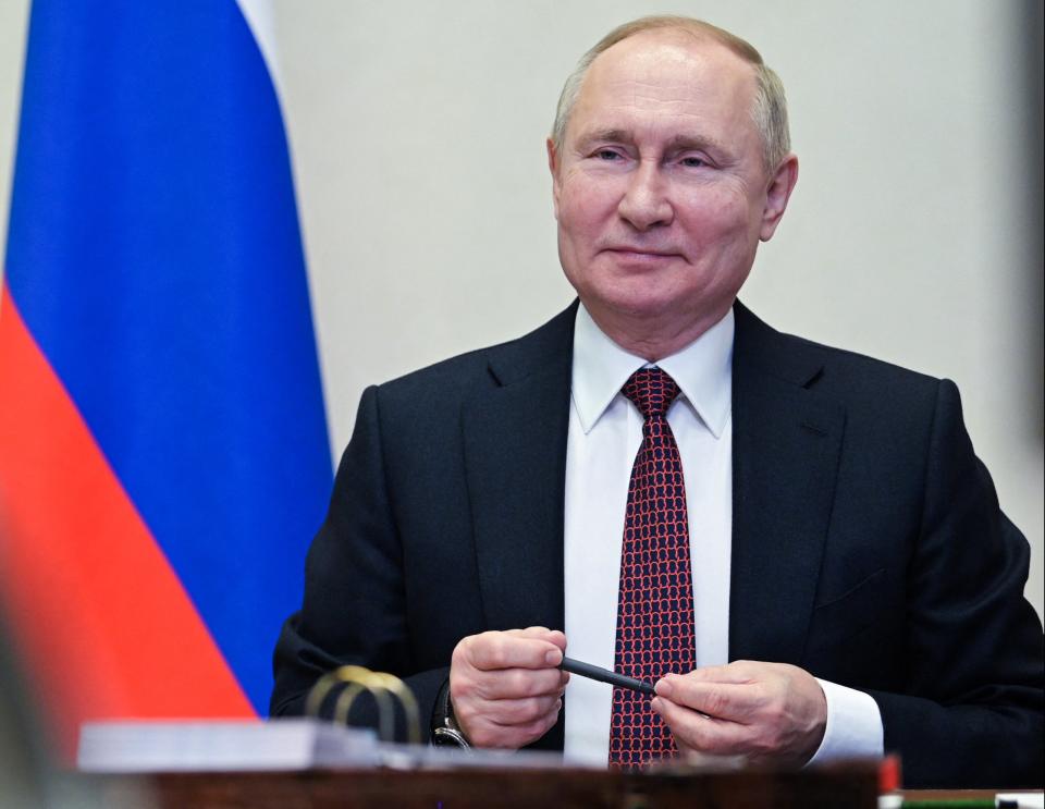 Russian President Vladimir Putin holds a meeting with members of Russia's national team ahead of the Beijing 2022 Winter Olympics, via a video conference (AFP via Getty Images)