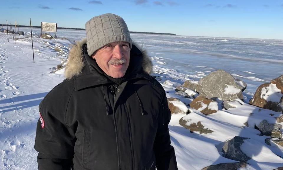 Ice fisherman Gaston Dionne calls for caution on the river ice, which is slow to thicken and not ready yet for ice fishing.