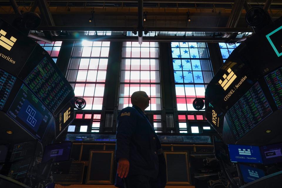 Traders work on the floor at the New York Stock Exchange in New York, Friday, July 1, 2022. Stocks are off to a weak start on Friday, continuing a dismal streak that pushed Wall Street into a bear market last month as traders worry that inflation will be tough to beat and that a recession could be on the way as well.